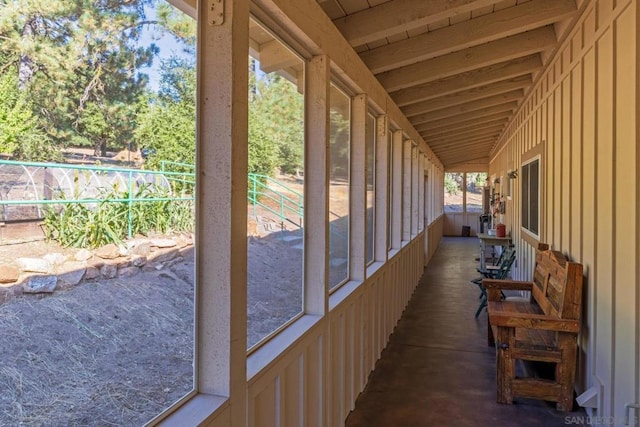 unfurnished sunroom with lofted ceiling and a healthy amount of sunlight