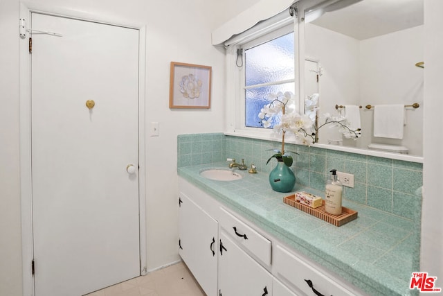 bathroom featuring backsplash and vanity