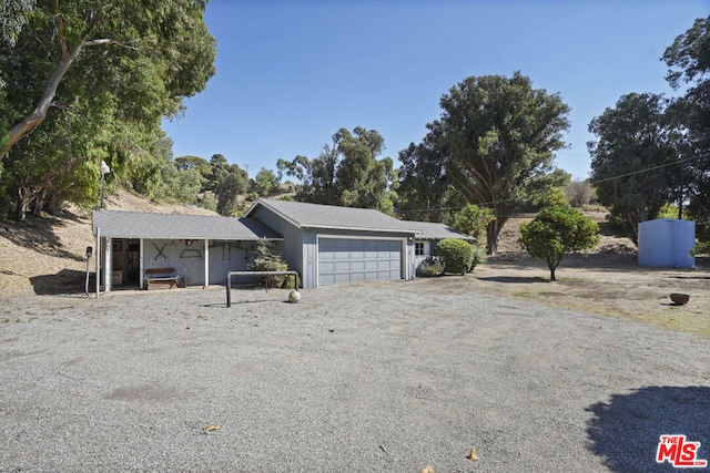 ranch-style house featuring a garage