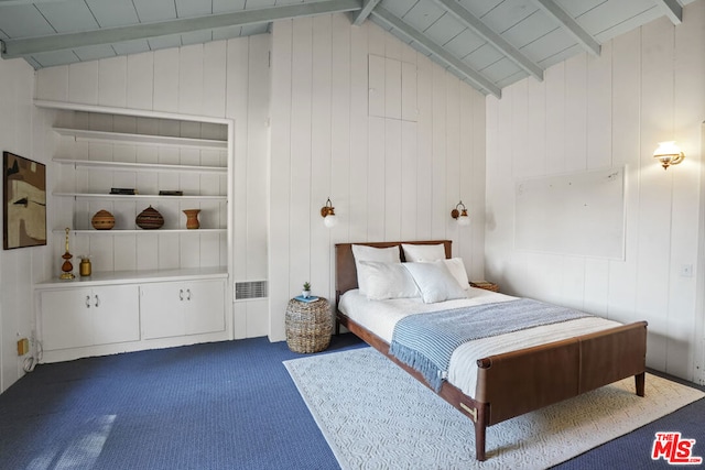 unfurnished bedroom with dark colored carpet, vaulted ceiling with beams, and wood walls