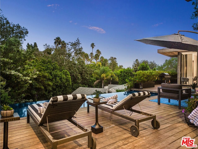 wooden deck featuring outdoor lounge area