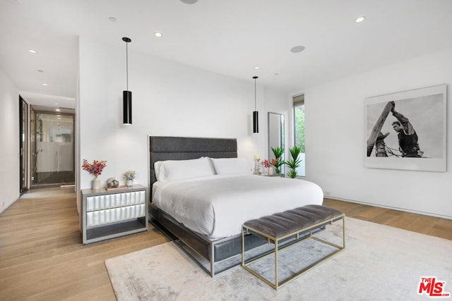 bedroom featuring light wood-type flooring