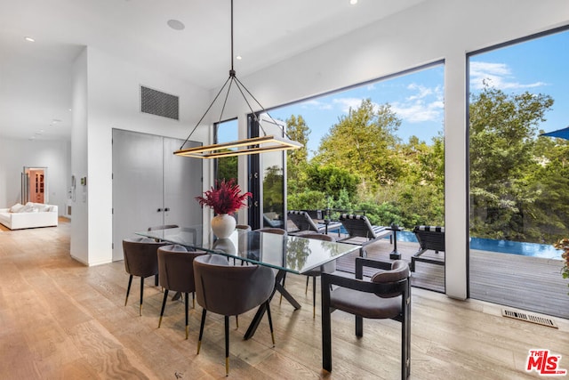 dining space with light wood-type flooring