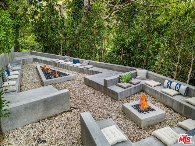 view of patio with an outdoor fire pit