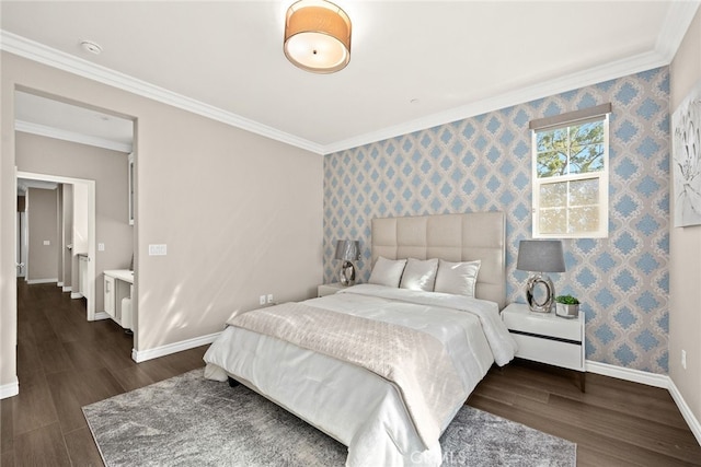 bedroom with ornamental molding and dark hardwood / wood-style floors