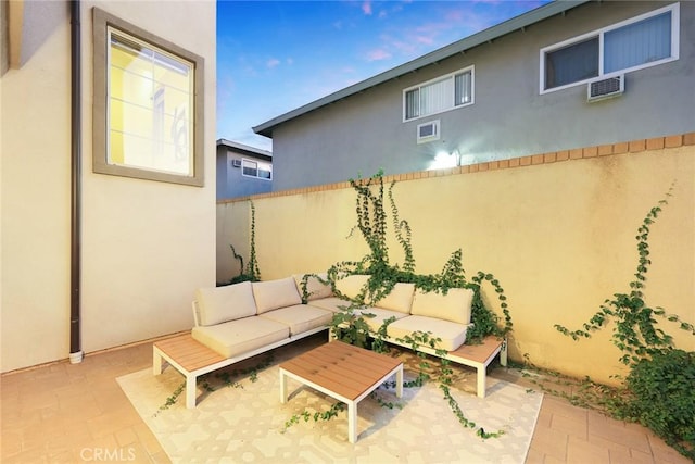 view of patio featuring an outdoor hangout area and a wall mounted air conditioner