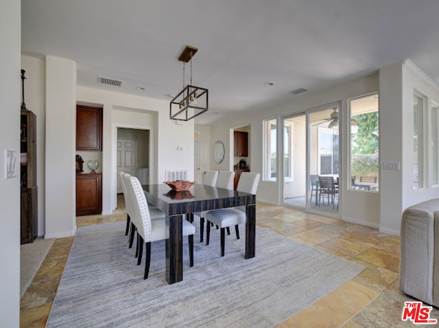 dining space featuring ceiling fan