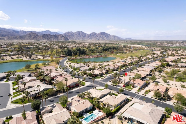 aerial view featuring a water and mountain view