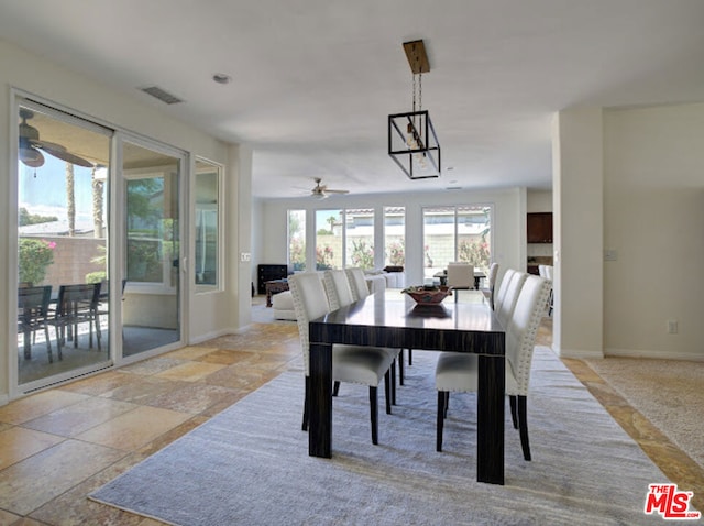 dining room featuring ceiling fan and plenty of natural light