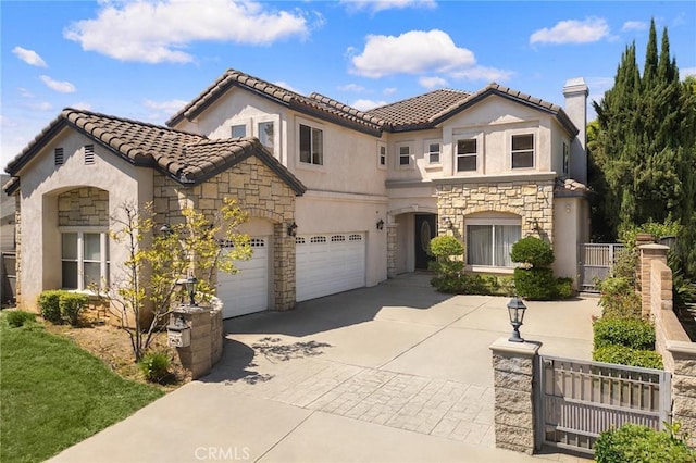 mediterranean / spanish-style house featuring a garage