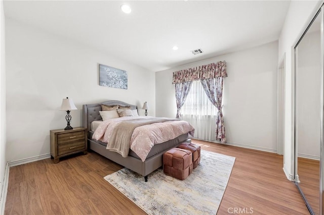 bedroom with hardwood / wood-style flooring