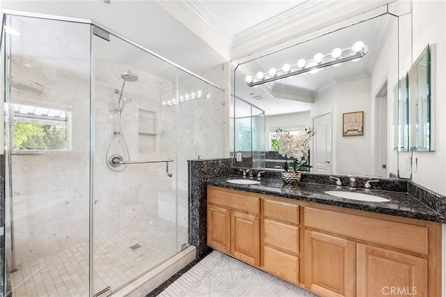 bathroom with vanity, an enclosed shower, and crown molding