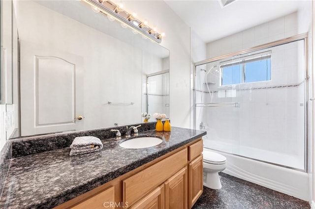 full bathroom with vanity, toilet, and enclosed tub / shower combo