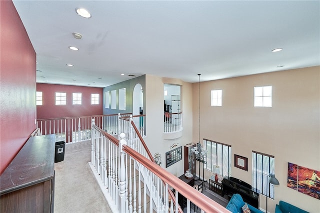 corridor with light colored carpet