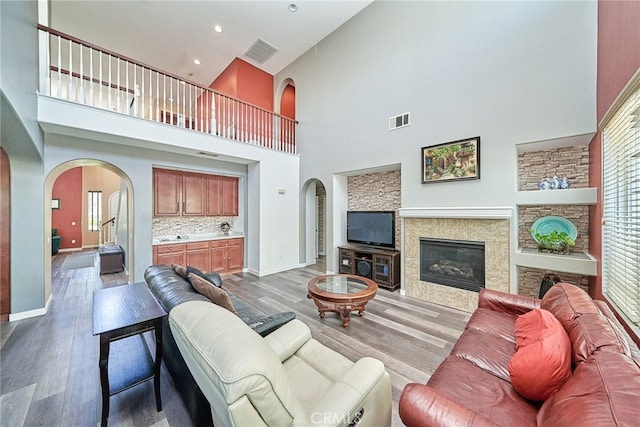 living room featuring hardwood / wood-style floors and a high ceiling