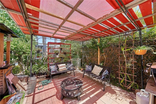 view of patio featuring a pergola and a fire pit