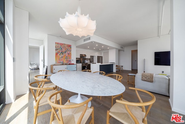 dining area featuring wood-type flooring