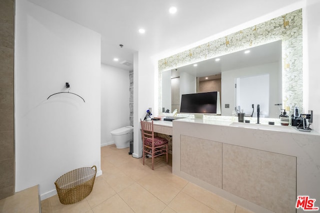 bathroom with vanity, tile patterned floors, and toilet