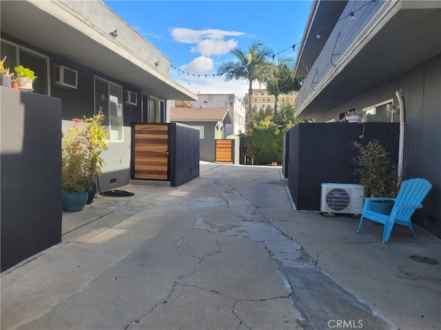 view of patio / terrace featuring ac unit and a wall unit AC