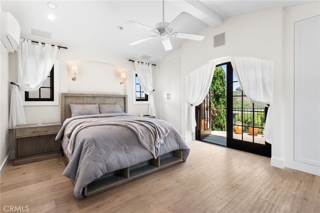 1165 Noria St, Laguna Beach, CA 92651 - bedroom featuring an AC wall unit, access to exterior, light wood finished floors, multiple windows, and recessed lighting