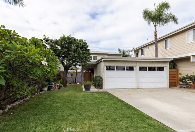 view of front facade with a front yard and a garage