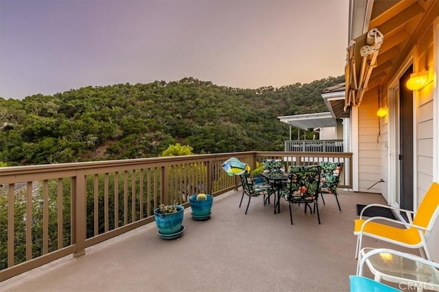 view of balcony at dusk