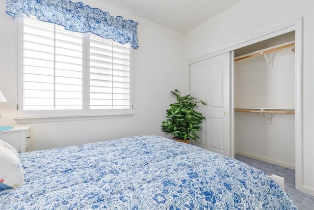 bedroom with carpet floors and a closet