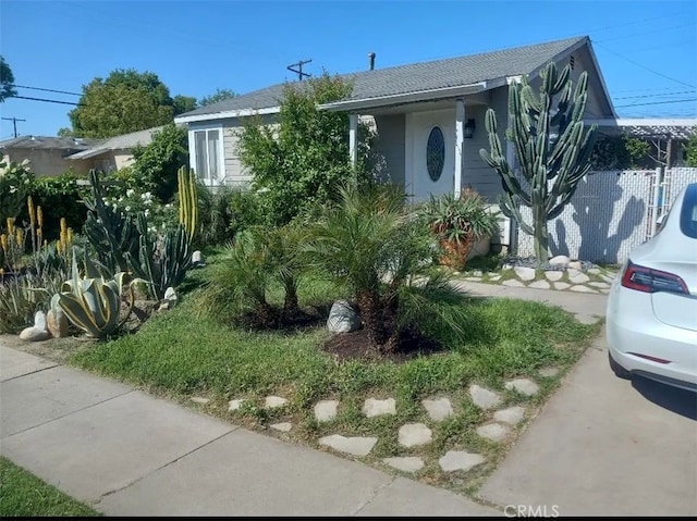 view of property hidden behind natural elements