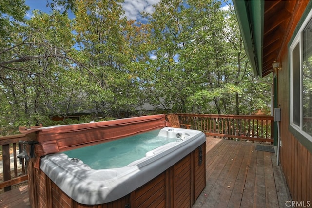 deck with a hot tub