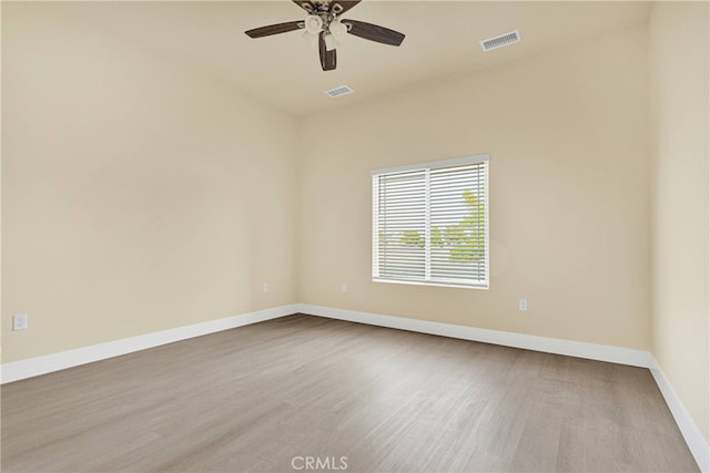 unfurnished room featuring light hardwood / wood-style floors and ceiling fan