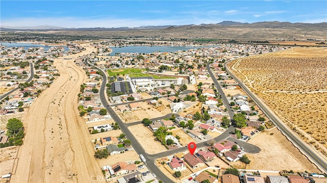 aerial view featuring a water and mountain view