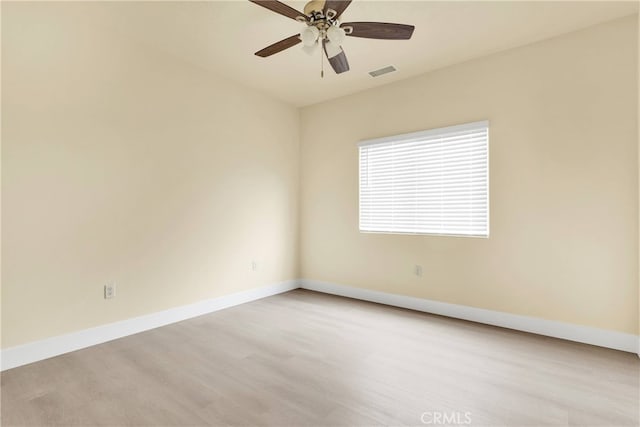 unfurnished room featuring ceiling fan and light hardwood / wood-style flooring