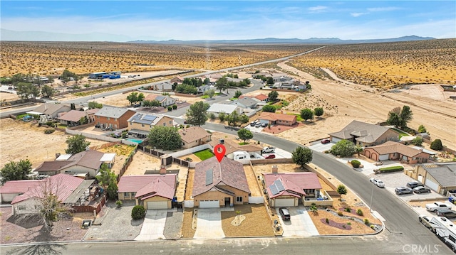 drone / aerial view featuring a mountain view