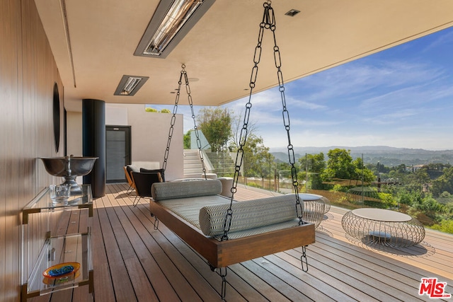 wooden deck featuring a mountain view