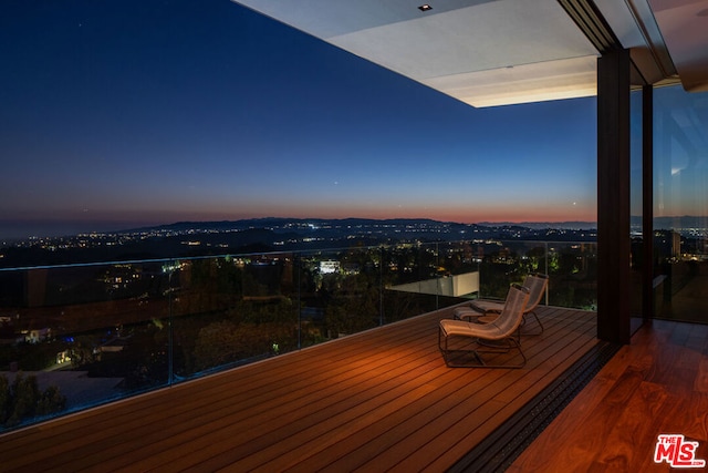 view of balcony at dusk