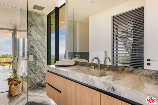 bathroom with vanity and plenty of natural light