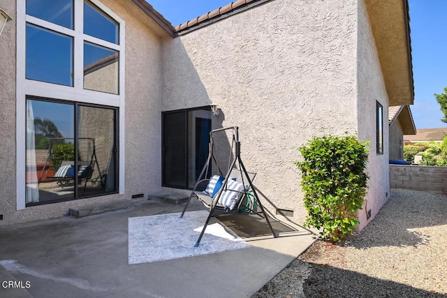 rear view of property featuring a patio area