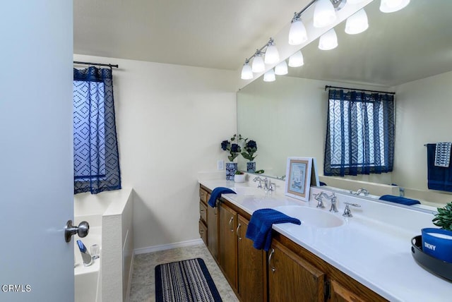 bathroom featuring tile patterned flooring and vanity