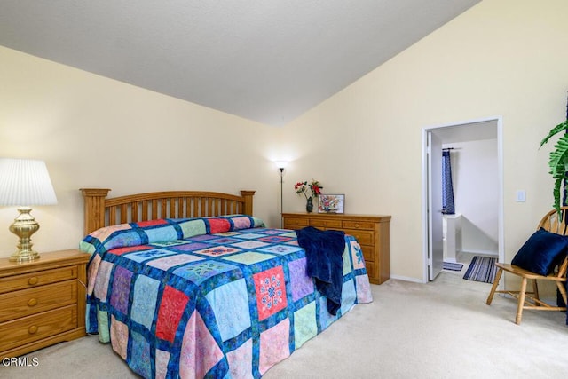 carpeted bedroom with vaulted ceiling