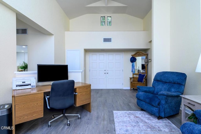 office area featuring dark hardwood / wood-style floors and high vaulted ceiling