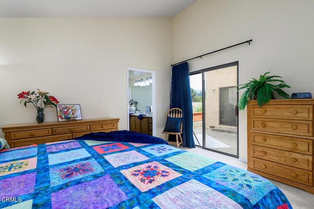 bedroom featuring access to exterior, light carpet, connected bathroom, and vaulted ceiling