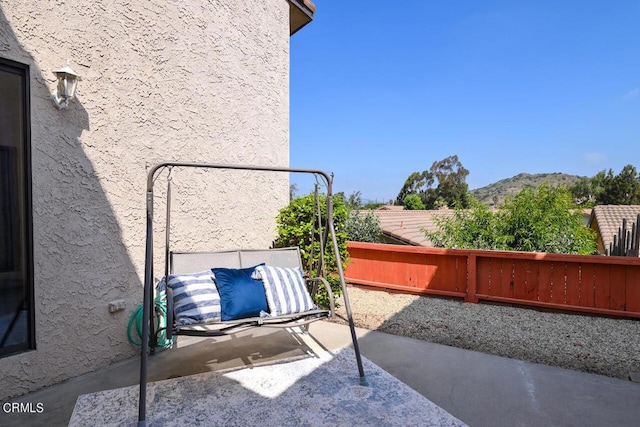 view of patio / terrace with a mountain view