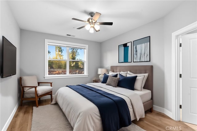 bedroom featuring light hardwood / wood-style flooring and ceiling fan