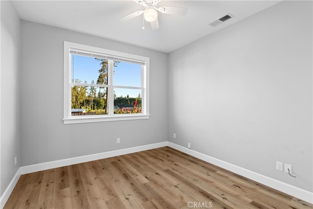 spare room with ceiling fan and light hardwood / wood-style flooring