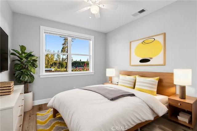 bedroom featuring wood-type flooring and ceiling fan