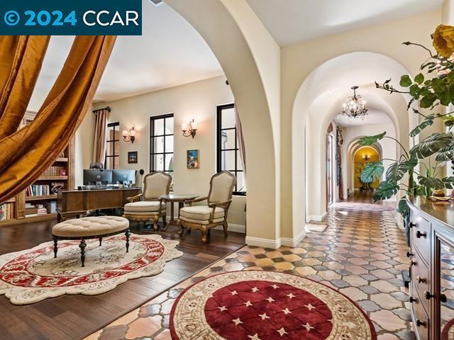 interior space with hardwood / wood-style flooring and an inviting chandelier