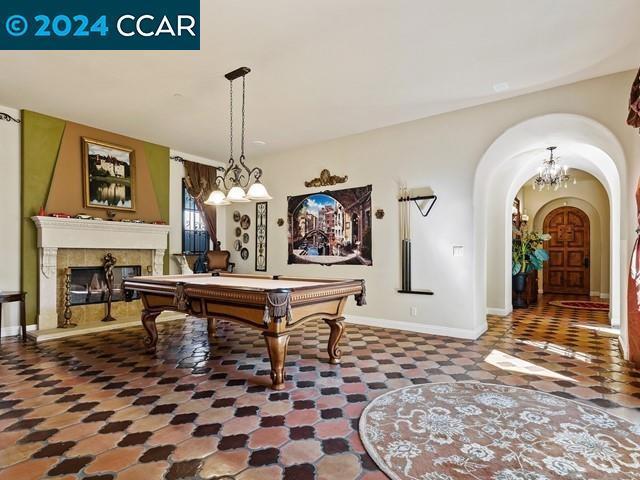 rec room with a tile fireplace, tile patterned flooring, and billiards