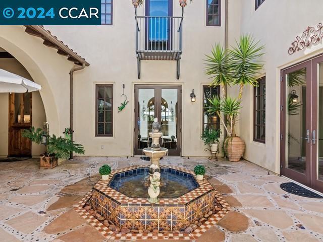 doorway to property featuring french doors and a patio