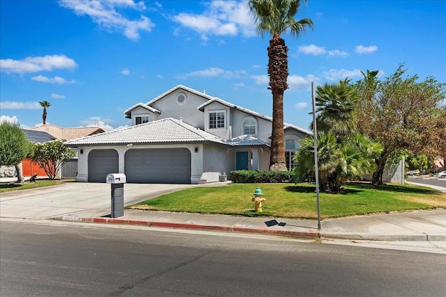 view of front facade with a garage and a front lawn