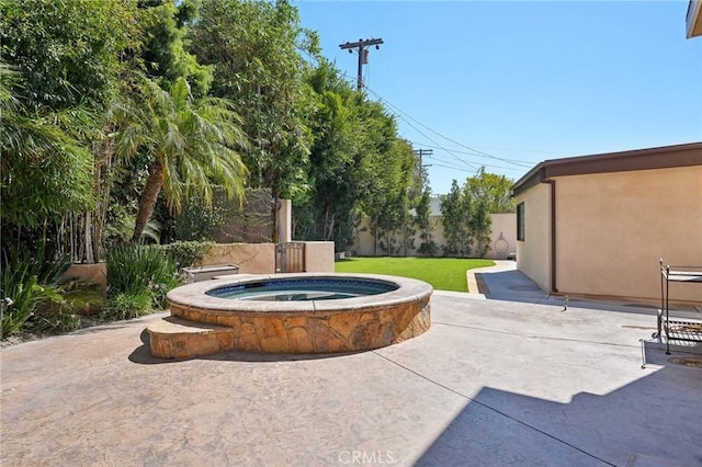 view of patio / terrace featuring an in ground hot tub